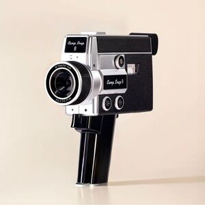 Retro Black and Silver Camera by Canon